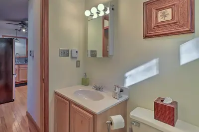 a bathroom with a sink and a mirror at Deck, Pool, Trails Access Pocono Family Home! in Albrightsville