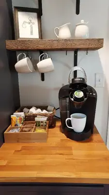 a kitchen counter with a coffee maker and a cup at Lewisburg duplex in Lewisburg