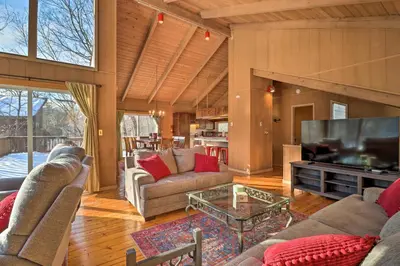 a living room with two couches and a television at Fire Pit and Grill Lakefront Poconos Cottage! in East Stroudsburg