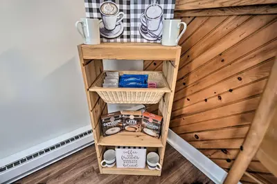 a small wooden shelf with food and mugs on it at Less Than 1 Mi to Jack Frost Lake Harmony Townhome! in Lake Harmony
