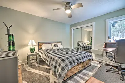 a bedroom with a bed and a desk and a window at Less Than 1 Mi to Jack Frost Lake Harmony Townhome! in Lake Harmony