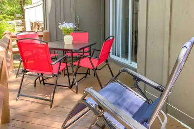 a patio with a table and chairs on a porch at Less Than 1 Mi to Jack Frost Lake Harmony Townhome! in Lake Harmony
