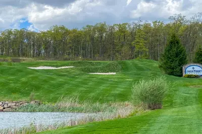 a view of a golf course with a pond at Less Than 1 Mi to Jack Frost Lake Harmony Townhome! in Lake Harmony