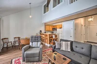 a living room with a couch and a table at Less Than 1 Mi to Jack Frost Lake Harmony Townhome! in Lake Harmony