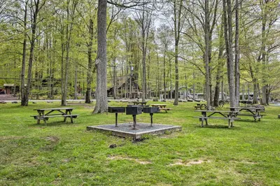 a group of picnic tables in a park at Near Skiing Pocono Lake Cabin with Screened Patio in Pocono Lake