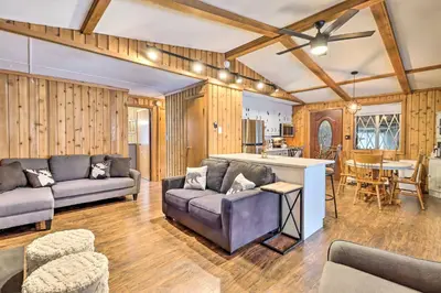 a living room with a couch and a table at Near Skiing Pocono Lake Cabin with Screened Patio in Pocono Lake