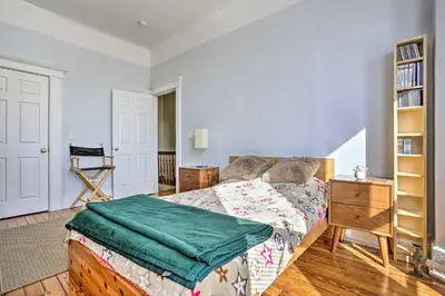 a bedroom with a bed and a book shelf at Contemporary Jersey City Abode about 5 Mi to NYC! in Jersey City