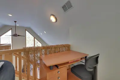 an office with a wooden desk and a chair at Large Deck and Resort Amenities Lake Ariel Retreat in Lake Ariel