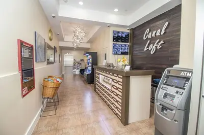 a fast food restaurant with a cash register and a bar at Canal Loft Hotel in New York