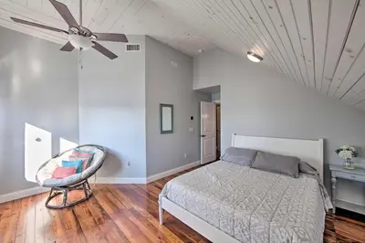 a bedroom with a bed and a ceiling fan at Dock and Hot Tub Susquehanna River Retreat! in Pequea