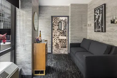 a living room with a couch and a table at The FIDI Hotel in New York