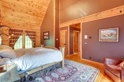 a bedroom with a bed in a room at Luxury Log Cabin with EV Charger and Mtn Views! in Blairstown