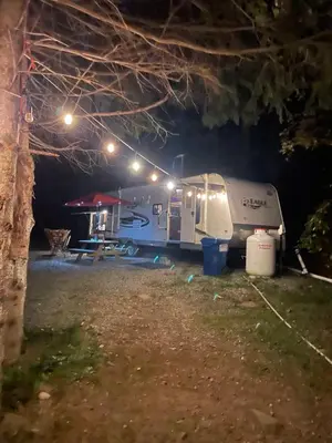 an rv parked at night with lights on it at Rv adventure Roscoe Pet friendly in Roscoe