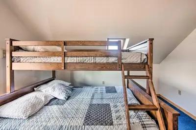 a bedroom with two bunk beds in a attic at Rural Dutch Country Retreat - Private Hot Tub in Dalmatia