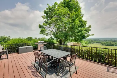 a wooden deck with a table and chairs on it at Rural Dutch Country Retreat - Private Hot Tub in Dalmatia