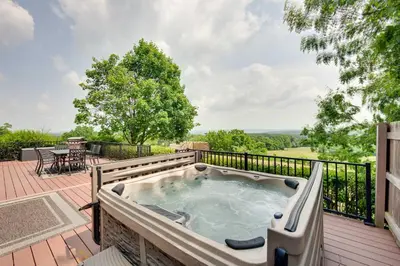a hot tub on the deck of a house at Rural Dutch Country Retreat - Private Hot Tub in Dalmatia