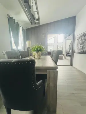 a dining room with a table and chairs at Amazing Poconos House . Sauna/Hot Tub/Private Pool in East Stroudsburg