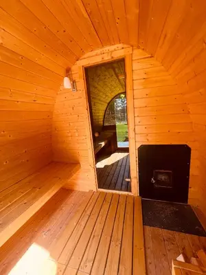 an inside view of a wooden sauna with a mirror at Amazing Poconos House . Sauna/Hot Tub/Private Pool in East Stroudsburg