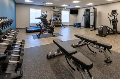 a gym with treadmills and elliptical machines at Hampton Inn Monticello, Ny in Monticello