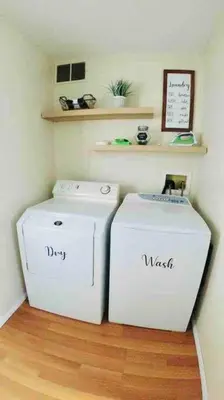 two white refrigerators in a room with wooden floors at Cozy Poconos Mountain House with 3 bedrooms in Tobyhanna