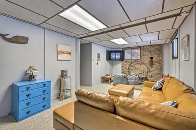 a living room with a couch and a blue dresser at Lake Ariel Home Less Than 1 Mi to Roaming Woods Lake! in Lake Ariel