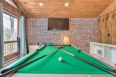 a pool table in a room with a tv at Lake Ariel Home Less Than 1 Mi to Roaming Woods Lake! in Lake Ariel