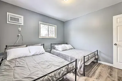 a bedroom with two beds and a window at Lake Ariel Home Less Than 1 Mi to Roaming Woods Lake! in Lake Ariel