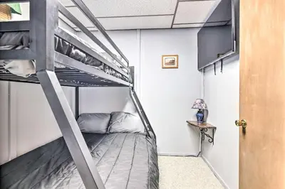 a bunk bed in a small room with a ladder at Lake Ariel Home Less Than 1 Mi to Roaming Woods Lake! in Lake Ariel