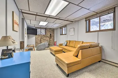 a living room with a couch and a table at Lake Ariel Home Less Than 1 Mi to Roaming Woods Lake! in Lake Ariel
