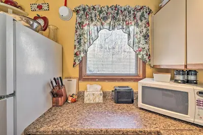 a kitchen with a microwave and a window at Next to Shawnee Mtn Ski Area Inviting Condo! in East Stroudsburg