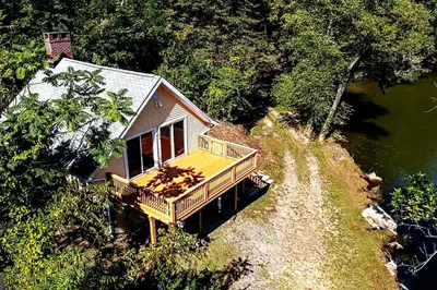 an aerial view of a house next to a river at Boat House in Downingtown