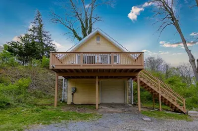 a house with a deck on top of it at Boat House in Downingtown