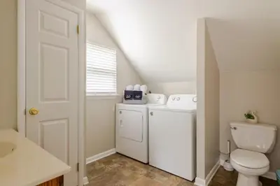 a small bathroom with a toilet and a sink at Boat House in Downingtown