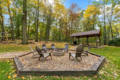 a group of chairs and a table and a gazebo at 5 bd w Hottub - mins to Hunting Hiking & Fishing in New Providence