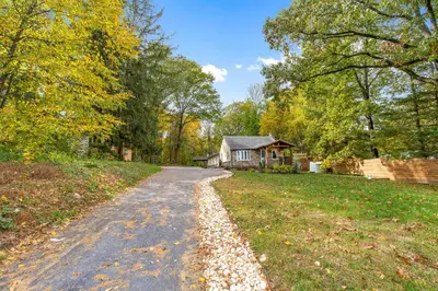 a road leading to a house in the woods at 5 bd w Hottub - mins to Hunting Hiking & Fishing in New Providence