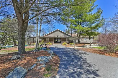 a house with a tree and a driveway at 1 Mi to Lake Family-Friendly Tobyhanna Home in Tobyhanna