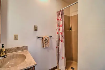 a bathroom with a sink and a shower at about 1 Mi to Lake Secluded Poconos Home with Decks in Jim Thorpe