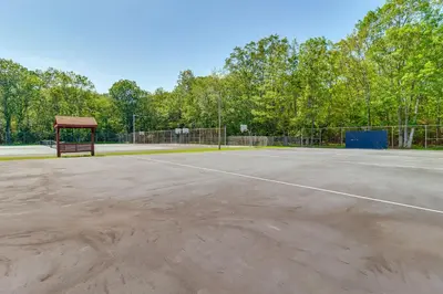 a tennis court with a gazebo on it at about 1 Mi to Lake Secluded Poconos Home with Decks in Jim Thorpe