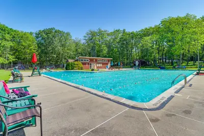 an empty swimming pool at a park with benches at about 1 Mi to Lake Secluded Poconos Home with Decks in Jim Thorpe