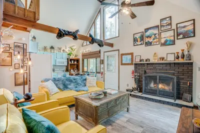 a living room with a couch and a fireplace at Elmwood Elmwood Escape A Cozy Retreat at The Hideout in Hamlin