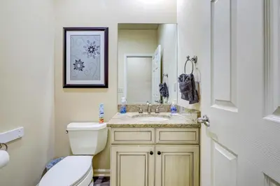a bathroom with a toilet and a sink at Pocono Retreat -1 Mile to Lake and Skiing! in Lake Harmony