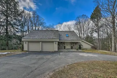 a house with a garage and a driveway at Catskill Getaway on 6 Acres with Swimming Pond! in Liberty