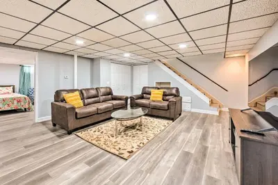 a living room with two couches and a table at Updated Home with Pool Table about 4 Mi to Hershey! in Palmyra