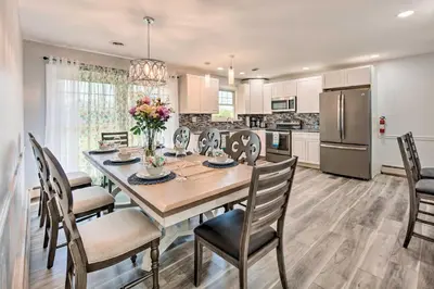 a kitchen and dining room with a table and chairs at Updated Home with Pool Table about 4 Mi to Hershey! in Palmyra