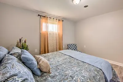 a bedroom with a bed and a window at Updated Home with Pool Table about 4 Mi to Hershey! in Palmyra