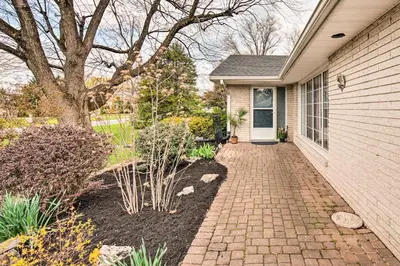 a brick walkway leading to a house with a tree at Updated Home with Pool Table about 4 Mi to Hershey! in Palmyra