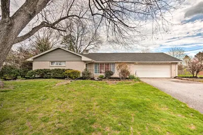 a house with a tree and a driveway at Updated Home with Pool Table about 4 Mi to Hershey! in Palmyra