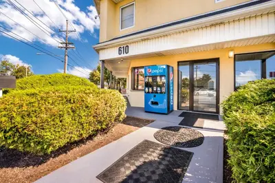 an atm machine in front of a building at Red Carpet inn Edison in Edison