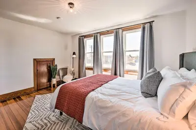 a bedroom with a large white bed and a window at Home 2 Mi to Hersheypark Work and Play! in Hershey