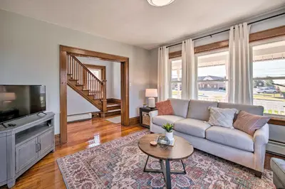 a living room with a couch and a tv at Home 2 Mi to Hersheypark Work and Play! in Hershey